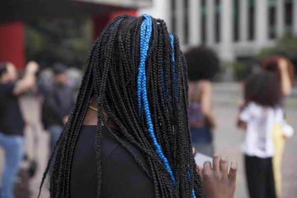 Woman wih dark brown marley twists with accent blue colour 