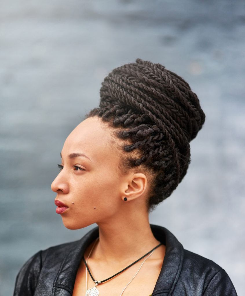 Woman with wrapped marley twists updo