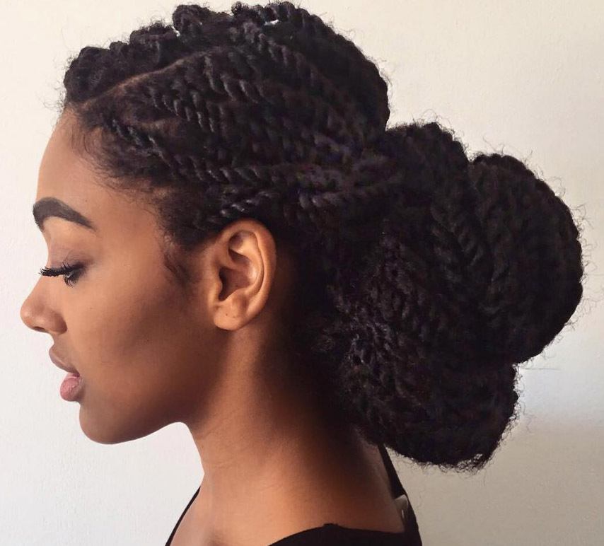 close up of vlogger curlbella with marley twists updo