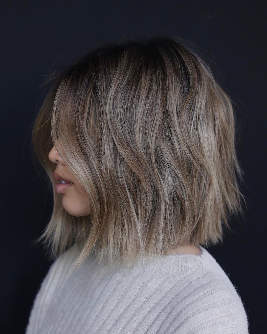Woman with ash brown medium bob with lived-in layers