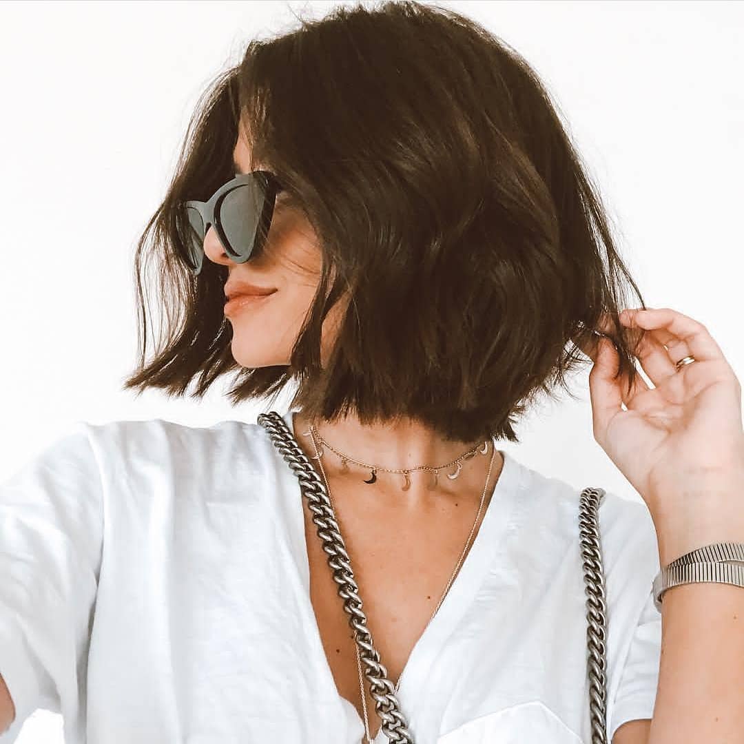 Woman with soft, dark layered bob