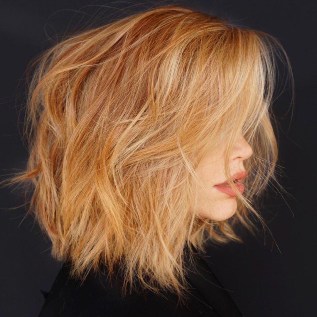 Woman with messy orange layered short haircut