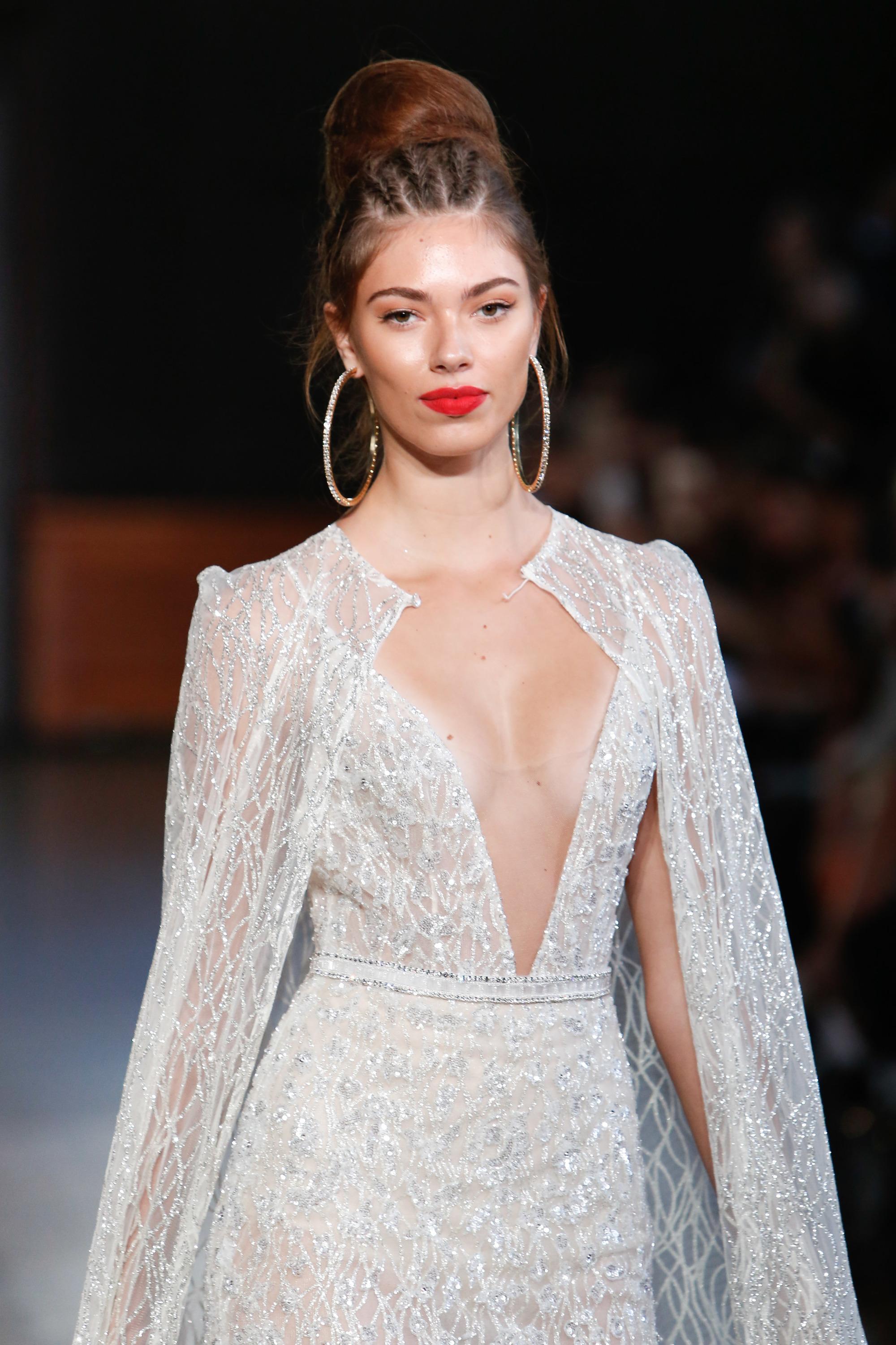 woman on the runway at bridal fashion week with a braided bun