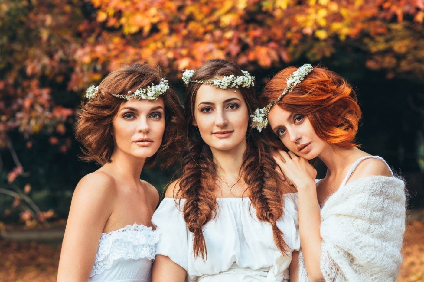 three bridal models with fishtail braid hairstyles