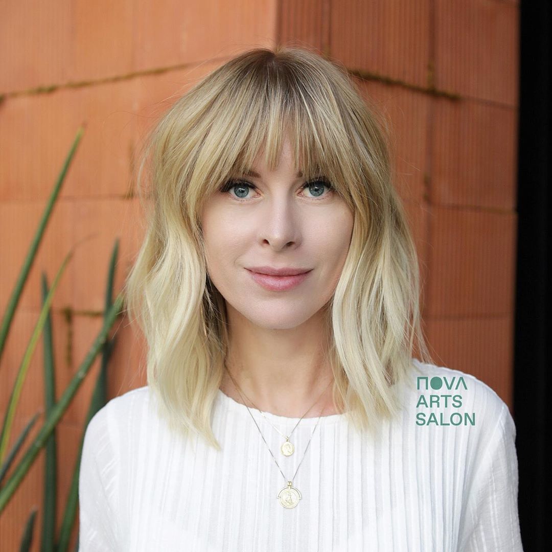Woman with blonde shoulder length French bob hair