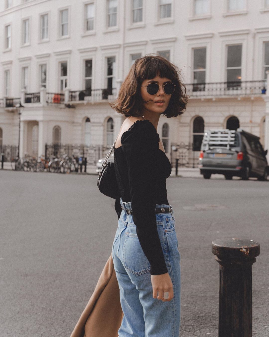 Woman with dark brown messy long bob with fringe