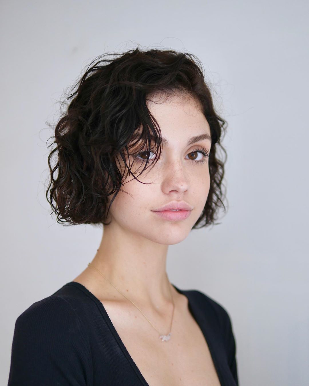 Woman with chin length bob with soft wet waves