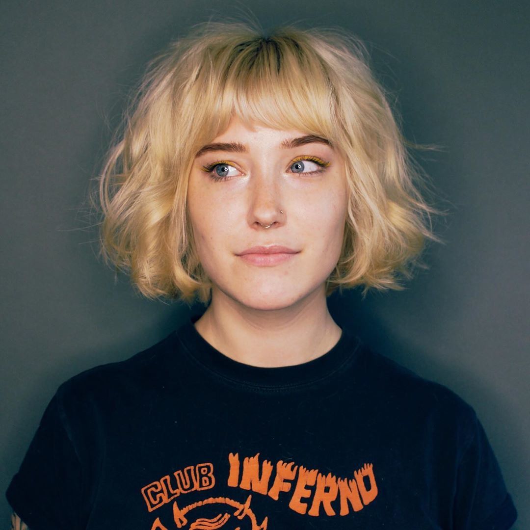 Woman with blonde messy French bob hairstyle