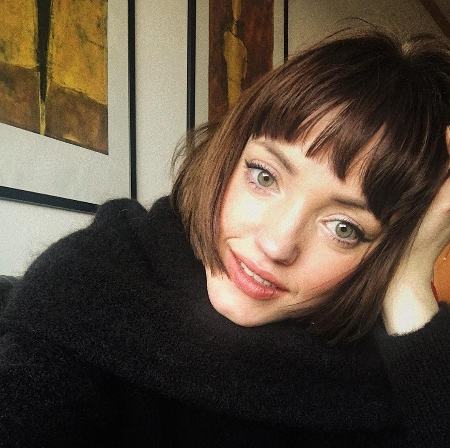 woman with short brunette french bob hair with a choppy fringe