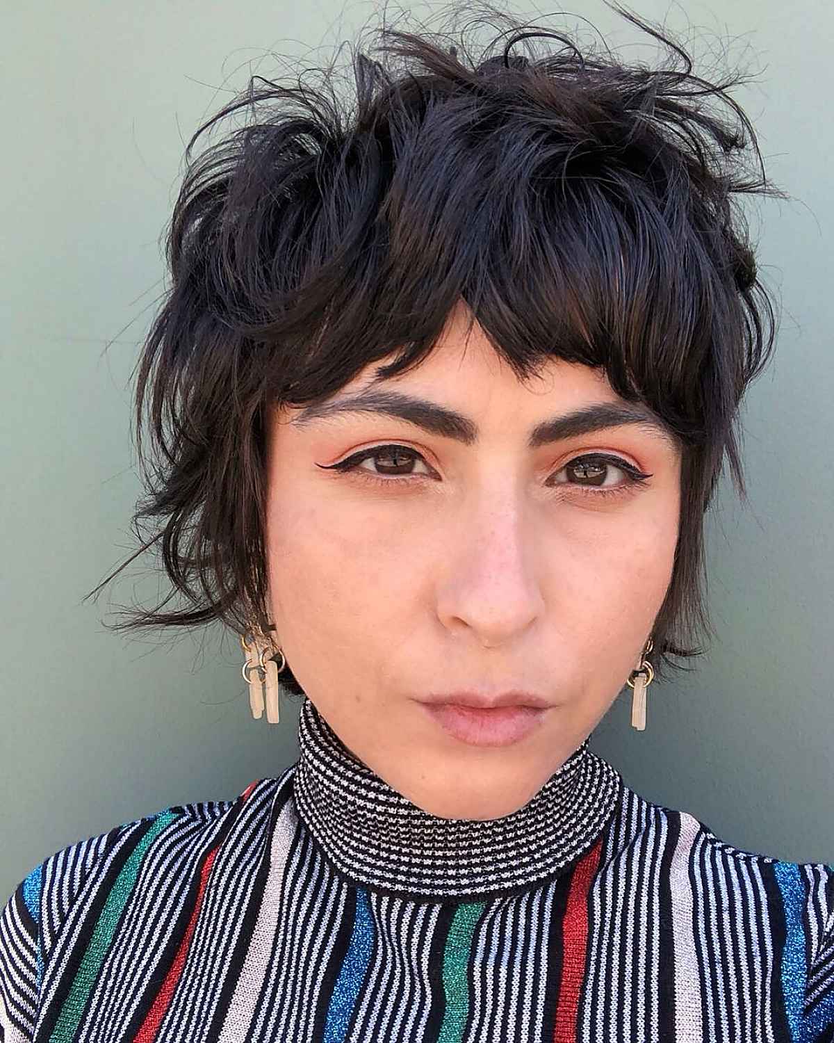 Coupe Pixie courte et hirsute avec franges
