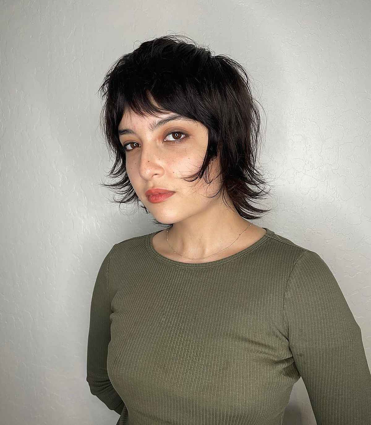 Coupe courte de type Mullet avec des cheveux courts