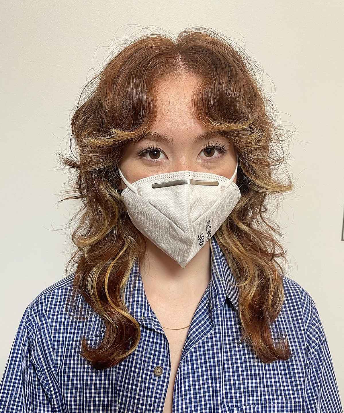Coupe de cheveux en mulets avec frange et coupe intermédiaire