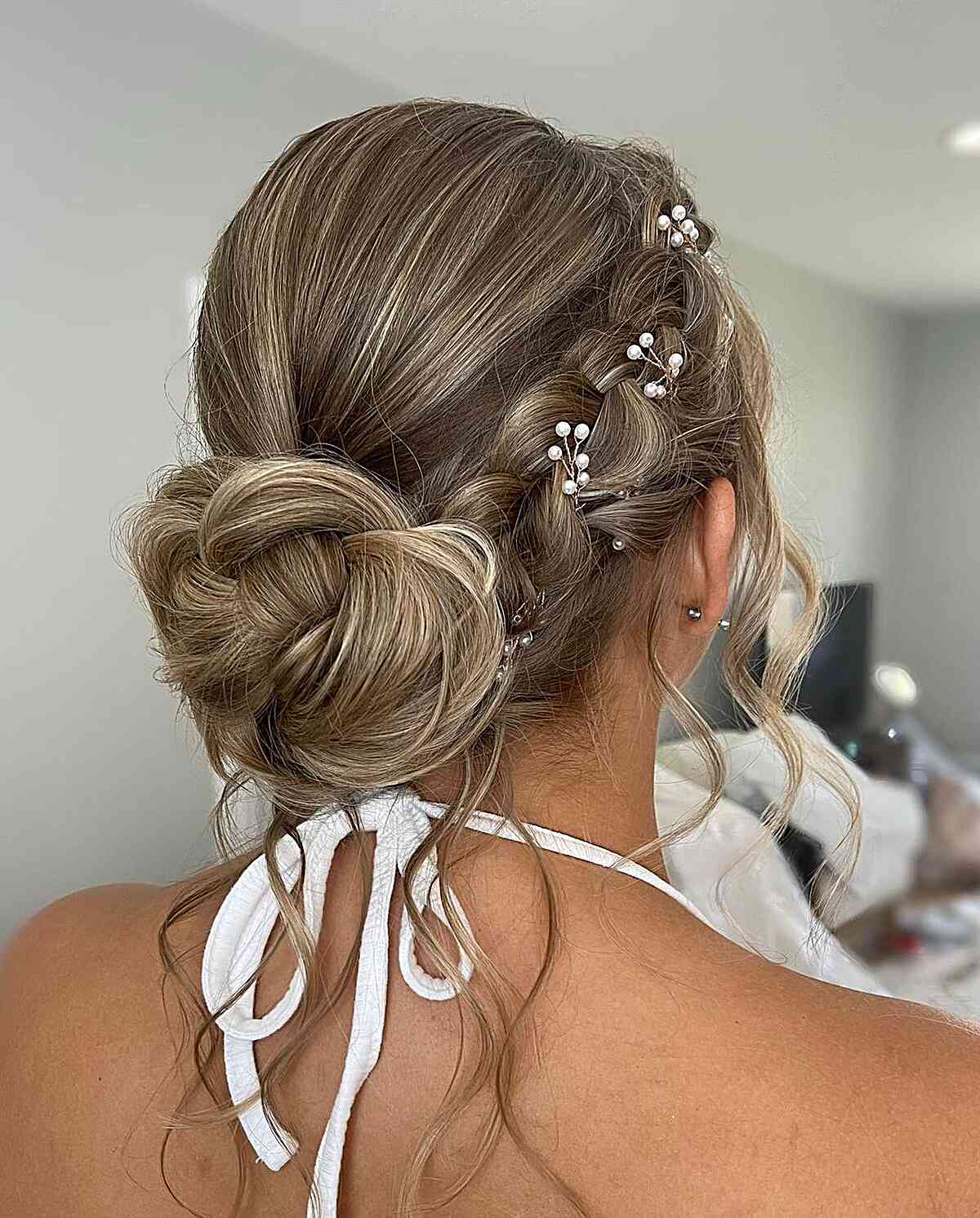 Medieval Romantic Bronde Low Bun with Side Braid