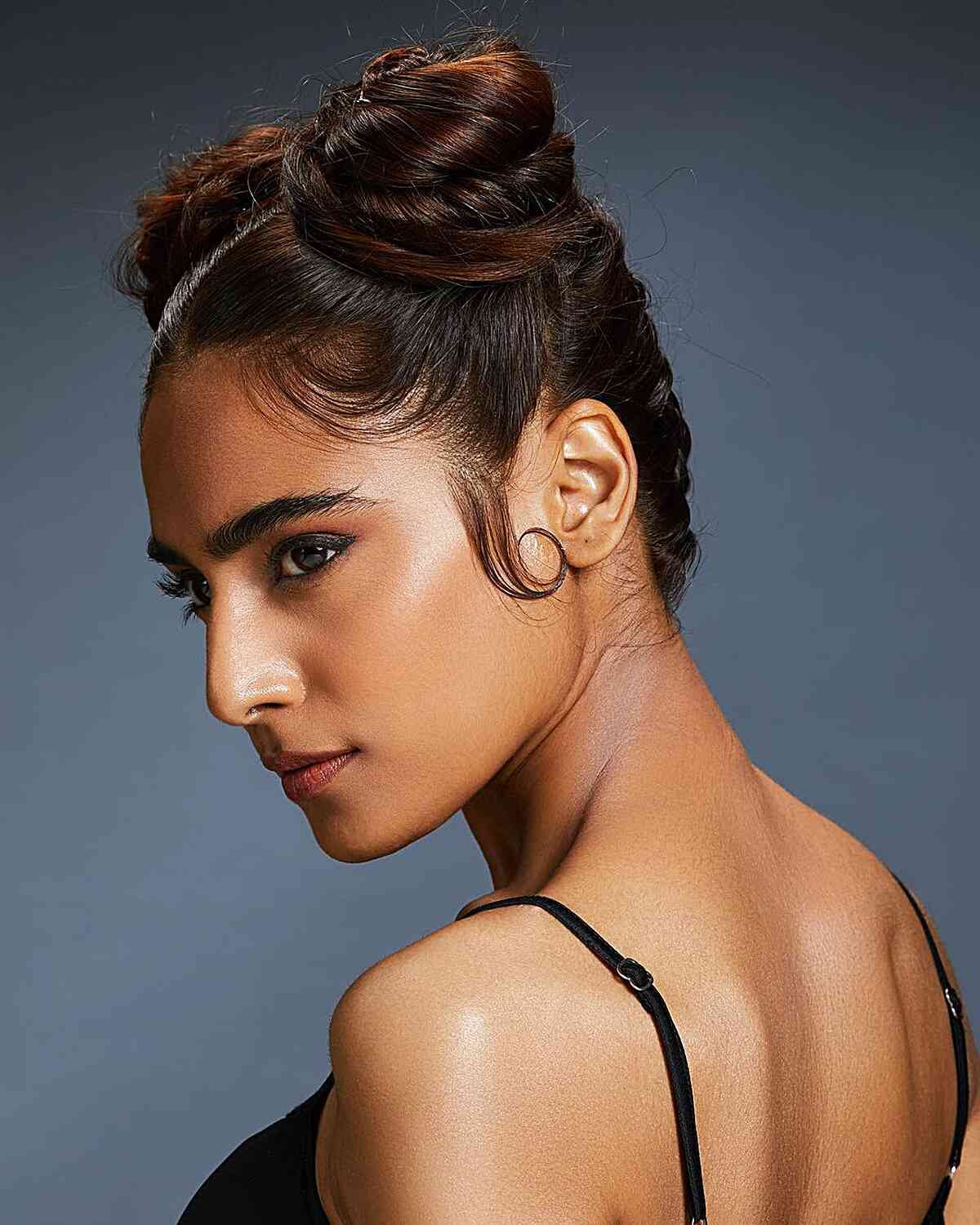 Center-Parted Double Bun Hairstyle for Cheerleaders